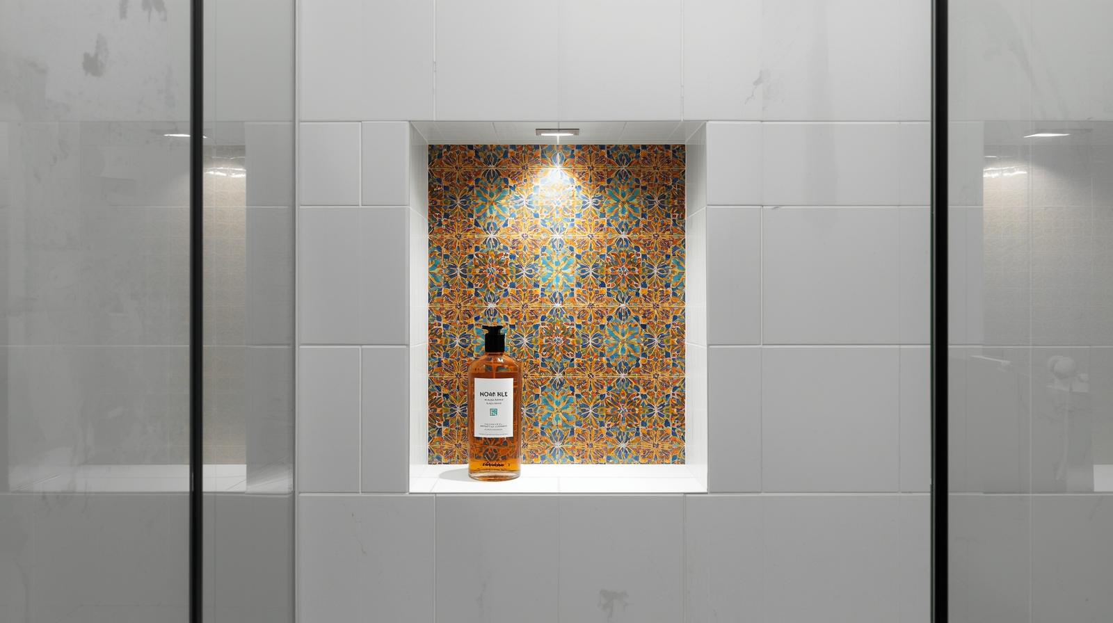 Shower niche tiled with accent pattern